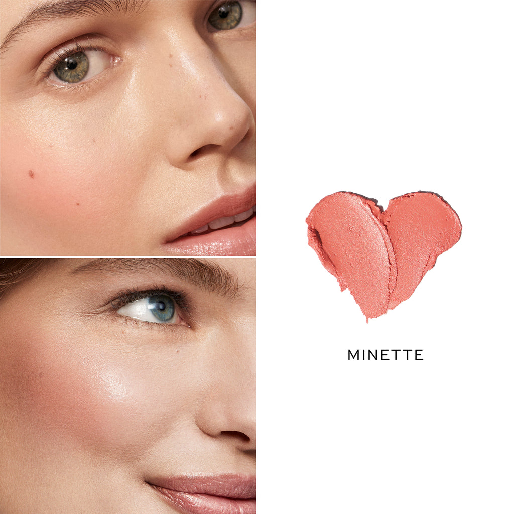 Close-up of a woman's face highlighting her green eyes and cheeks with a monochromatic look, next to a heart-shaped lipstick smear labeled "Westman Atelier Baby Cheeks Blush Stick.