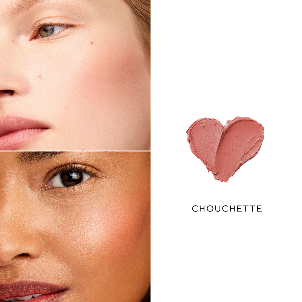 Split image showing close-ups of two women's faces with different skin tones, paired with a heart-shaped swatch of pink makeup labeled "Westman Atelier Baby Cheeks Blush Stick" featuring natural ingredients.