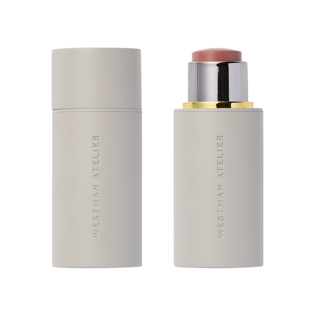 Two Westman Atelier Baby Cheeks Blush Stick products, one capped and one uncapped showing the buildable color, against a white background.