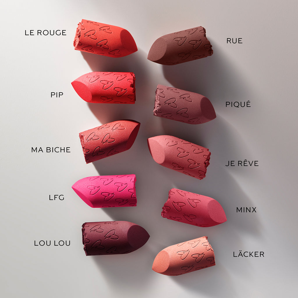 Array of colorful lipstick samples with corresponding shade names.