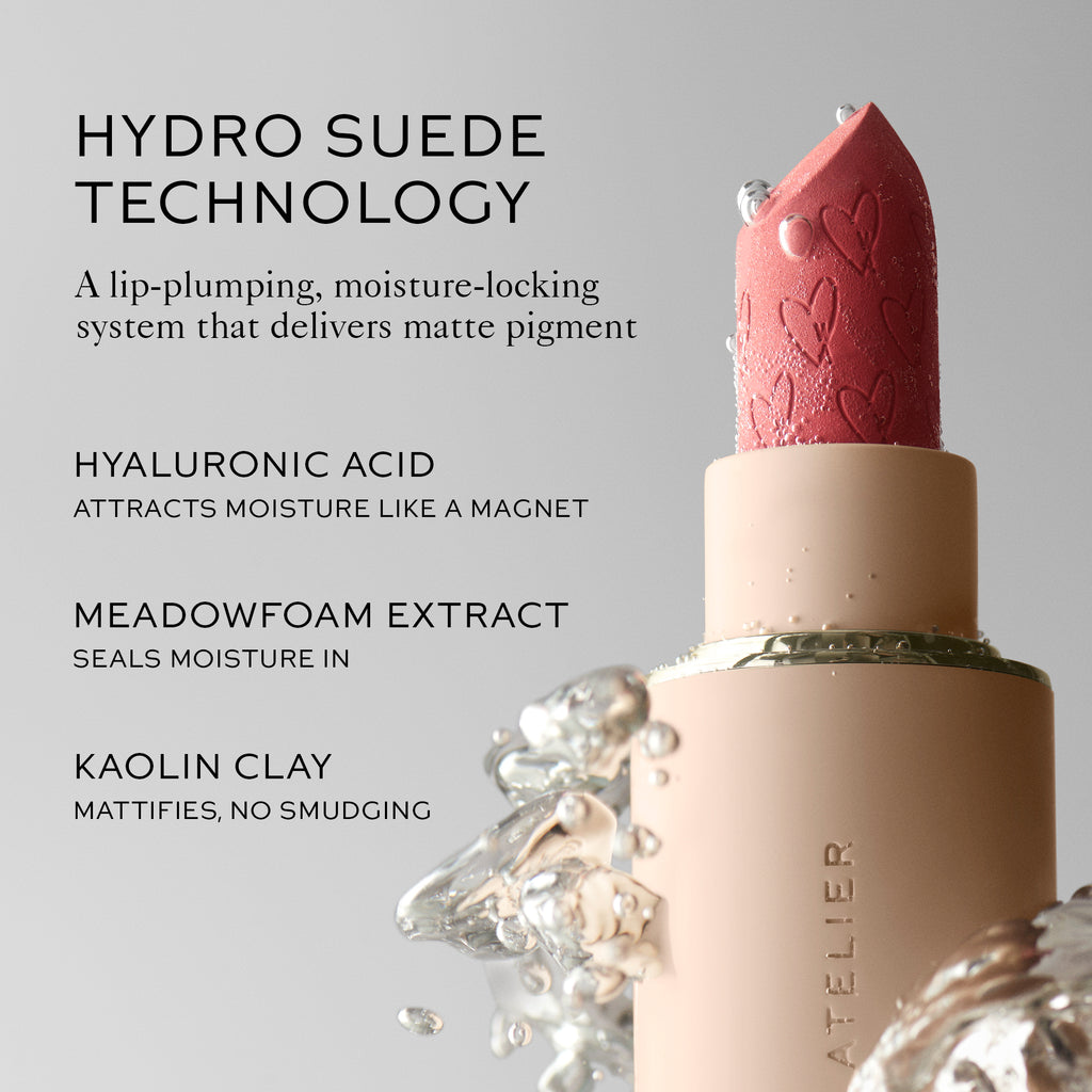 A close-up of a pink lipstick with embossed hearts, highlighting its hydrating ingredients and benefits.