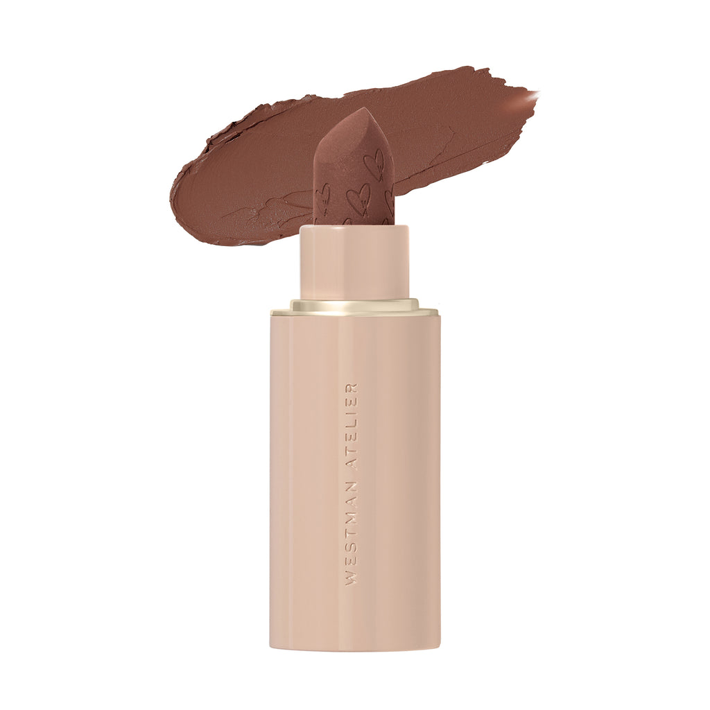 A stick of brown lipstick with a swatch of its color above it.