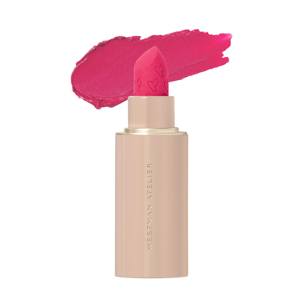 A swipe of pink lipstick with the cap removed showing the lipstick bullet.