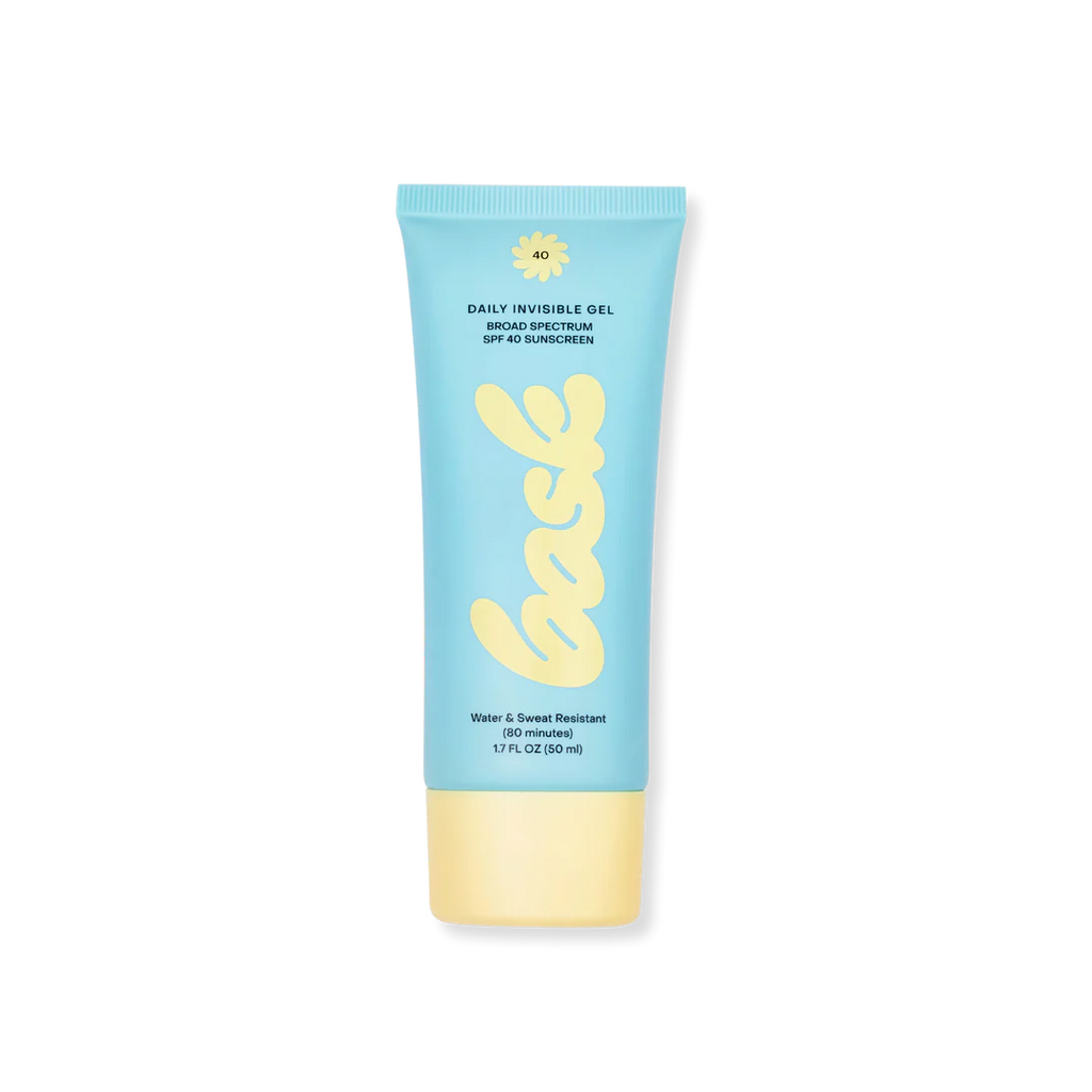 A tube of Bask Daily Invisible Gel SPF 40 sunscreen in a blue and yellow color scheme, isolated on a black background.
