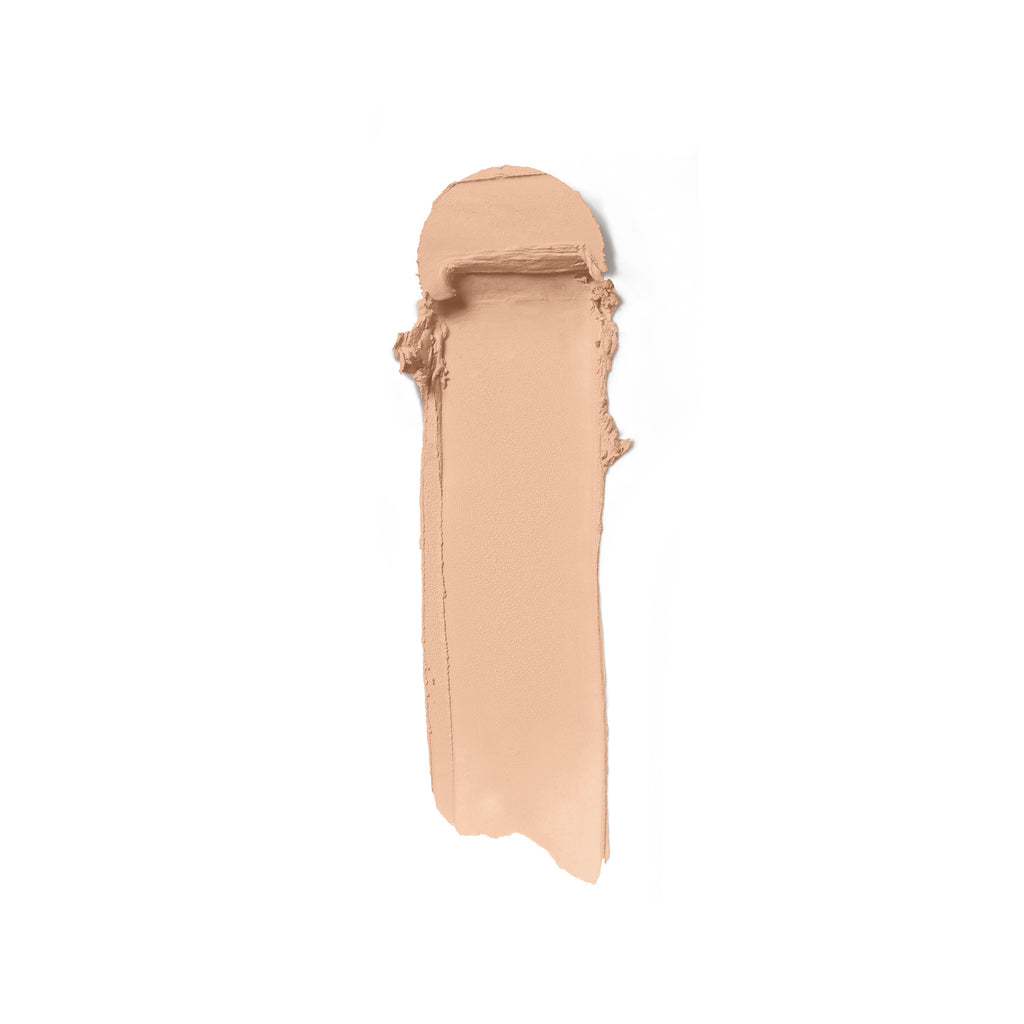 Swatch of beige foundation makeup on a white background.