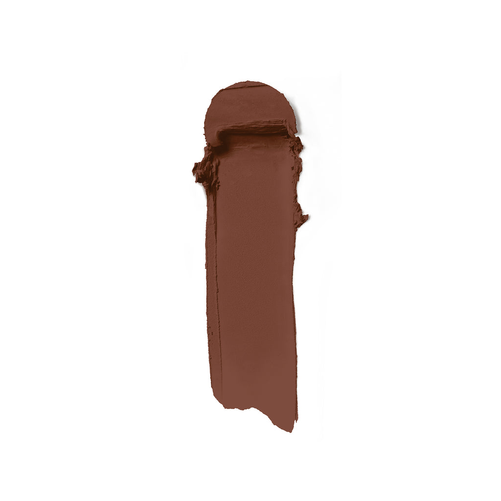 A swatch of rich brown lipstick smeared on a white background.