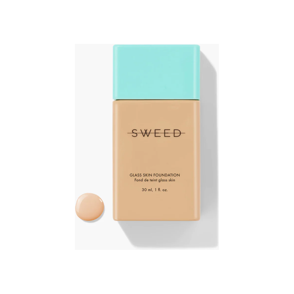 A bottle of Sweed Glass Skin Foundation with a drop of the product beside it, isolated on a white background.