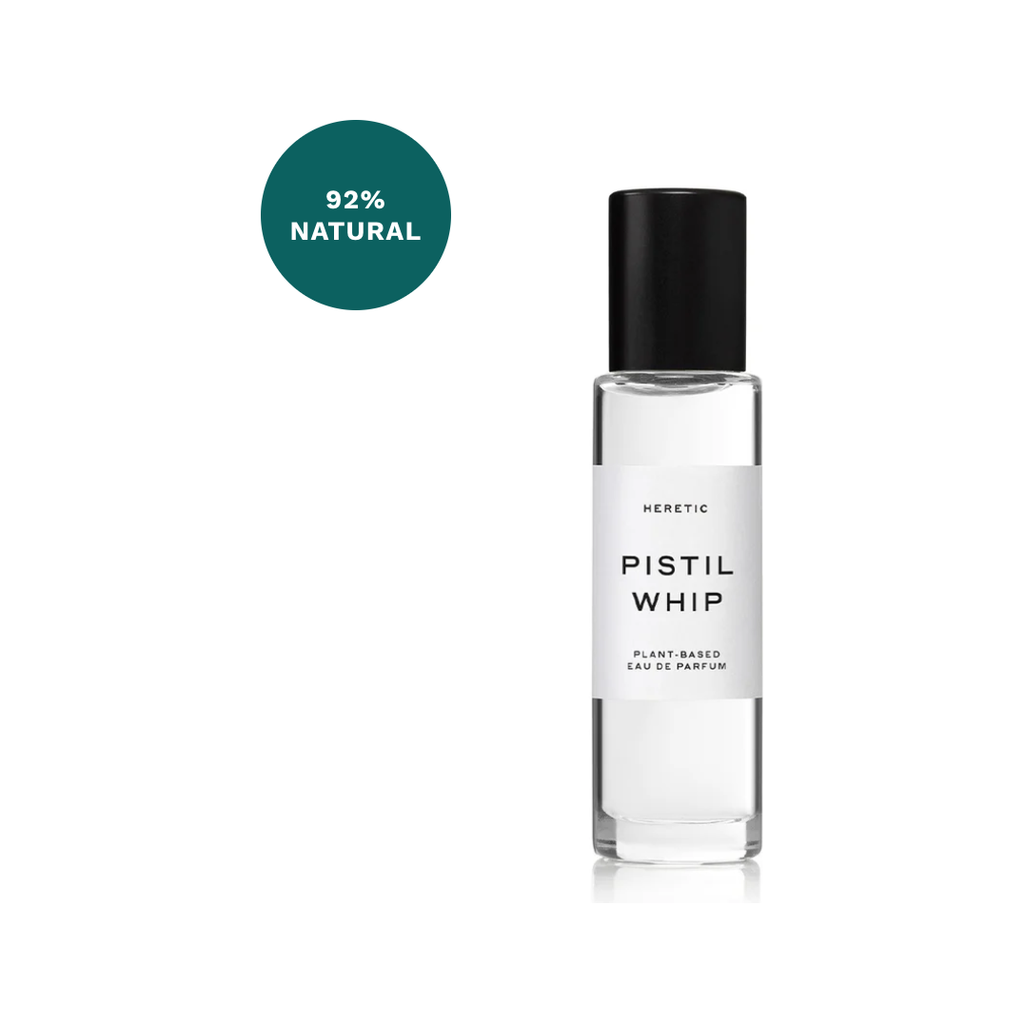 A bottle of Heretic Parfum Pistil Whip perfume labeled as “plant-based” and “92% natural,” with a black cap and clear body, infused with gardenia, displayed against a white background.