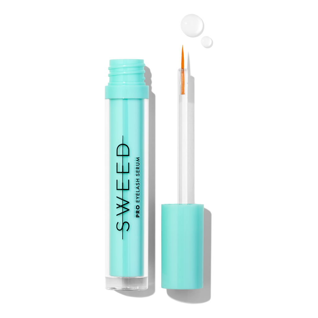 Cosmetic serum with dropper applicator and product drop floating above.