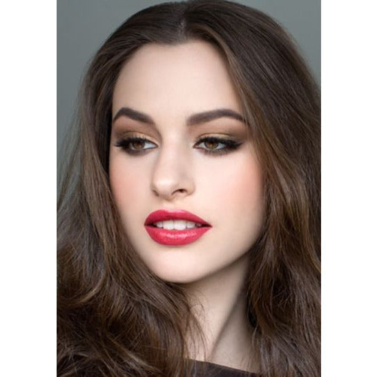 A portrait of a woman with well-defined makeup, featuring smoky eye shadow and red lipstick.
