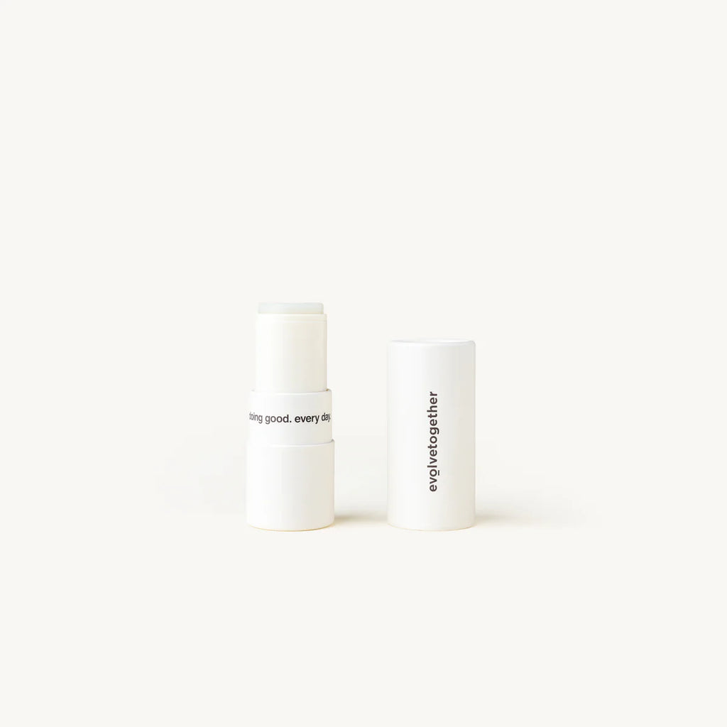 Two cylindrical white containers with black text on a plain background.