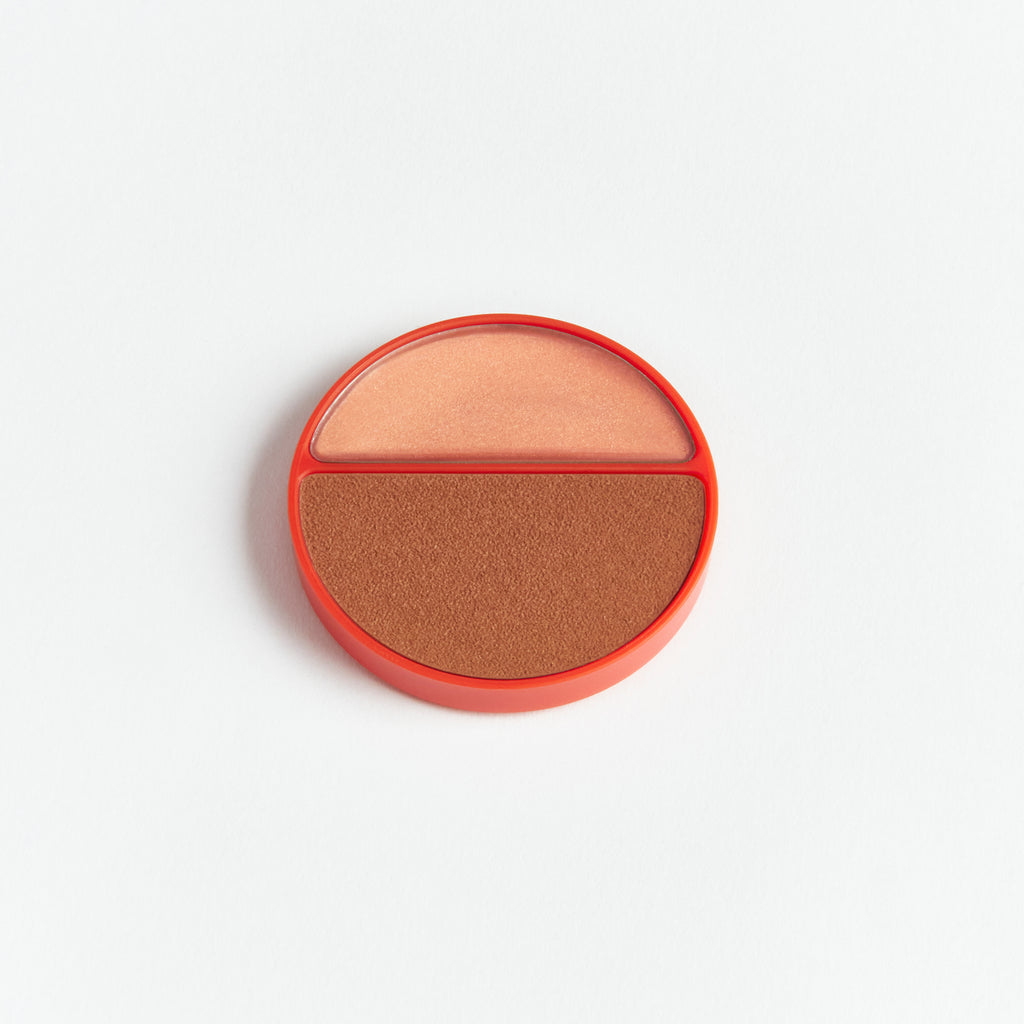 A dual-toned blush palette isolated on a white background.