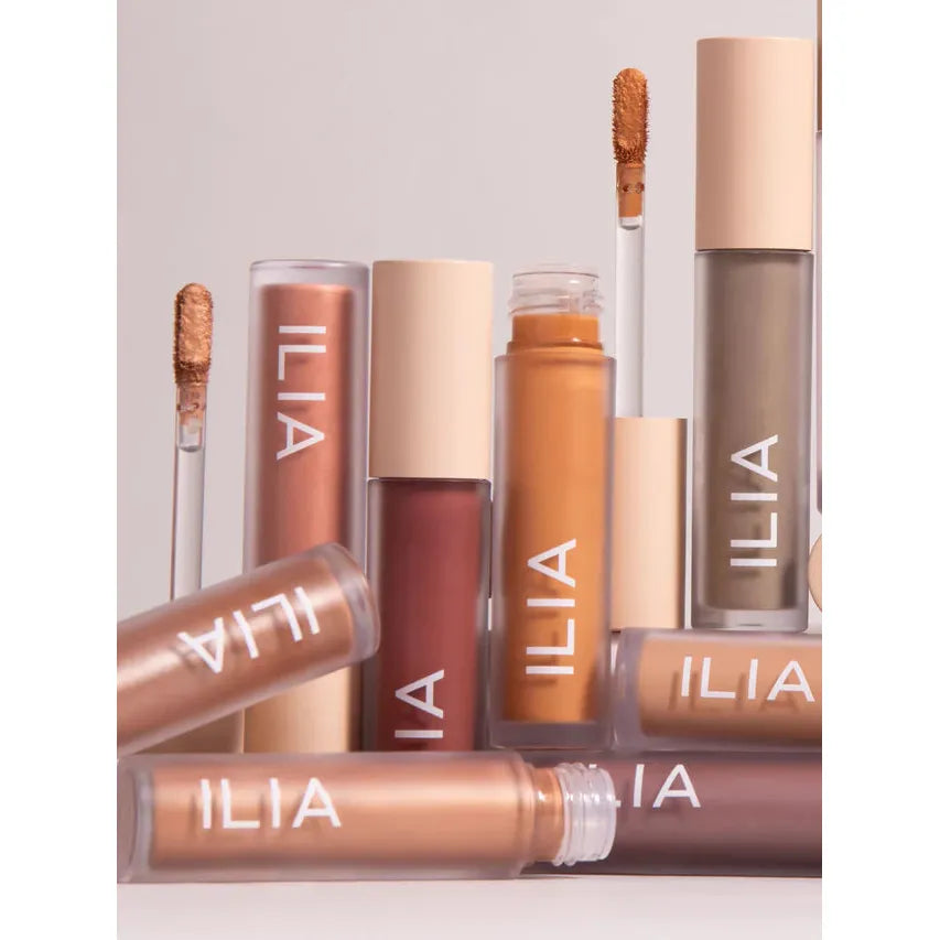 Range of ilia concealer cosmetics with the applicator wand visible.