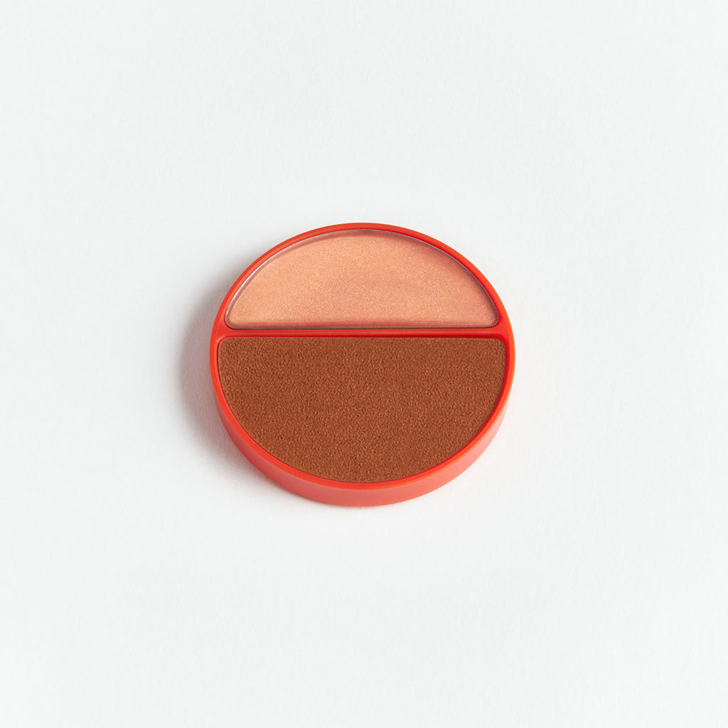 A dual-shade round compact blush on a white background.