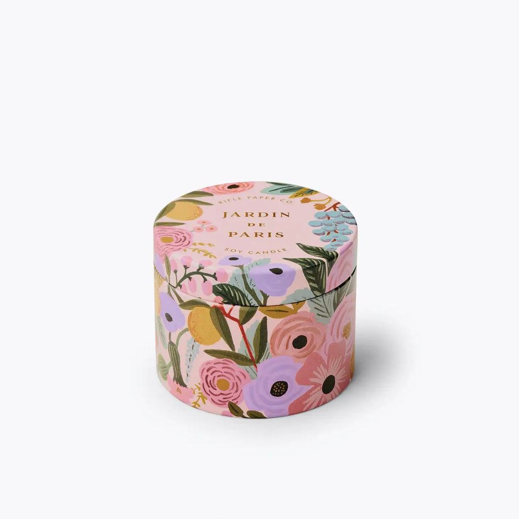 Floral-patterned cylindrical box with 'jardin de paris' text on a white background.