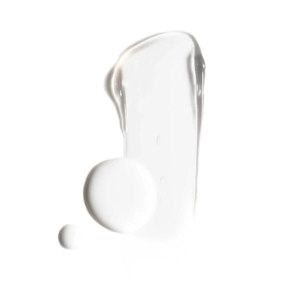 A smear of white cream or lotion isolated on a white background.