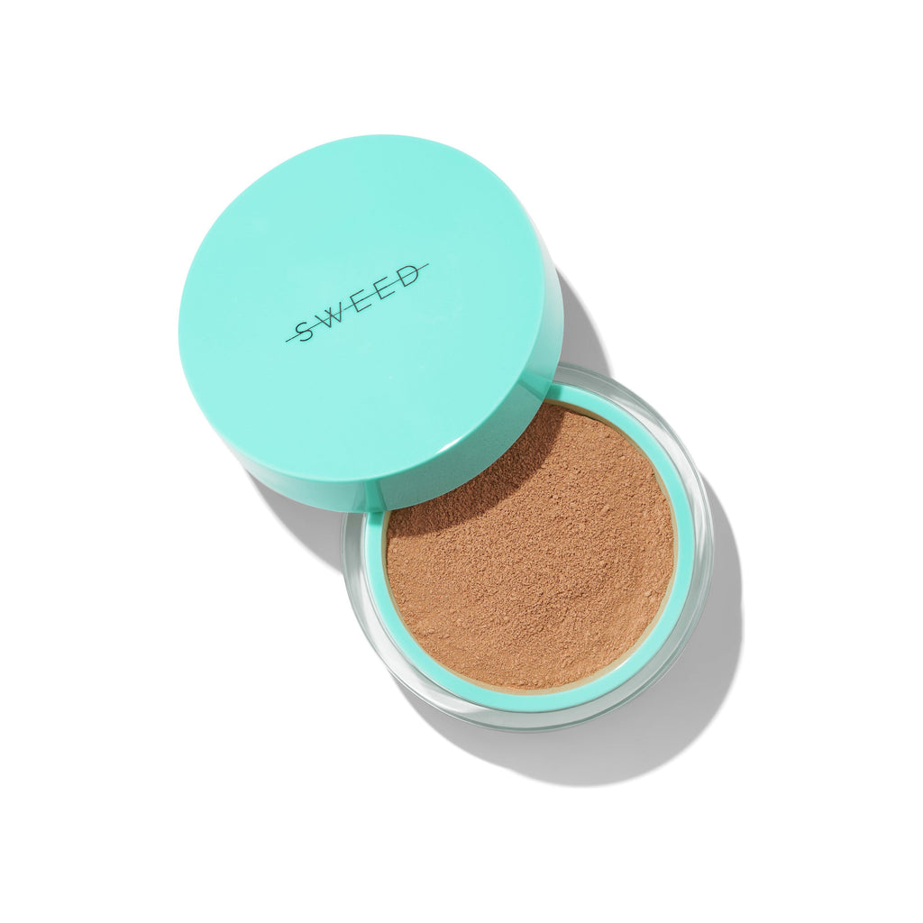 Compact cushion foundation with teal packaging on a white background.