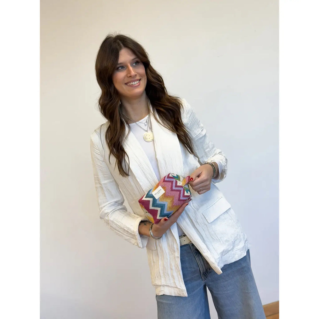 Model showing De La Mur Medium Makeup Bag Mera