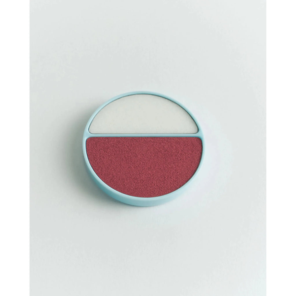 A compact blusher and highlighter duo on a plain background.