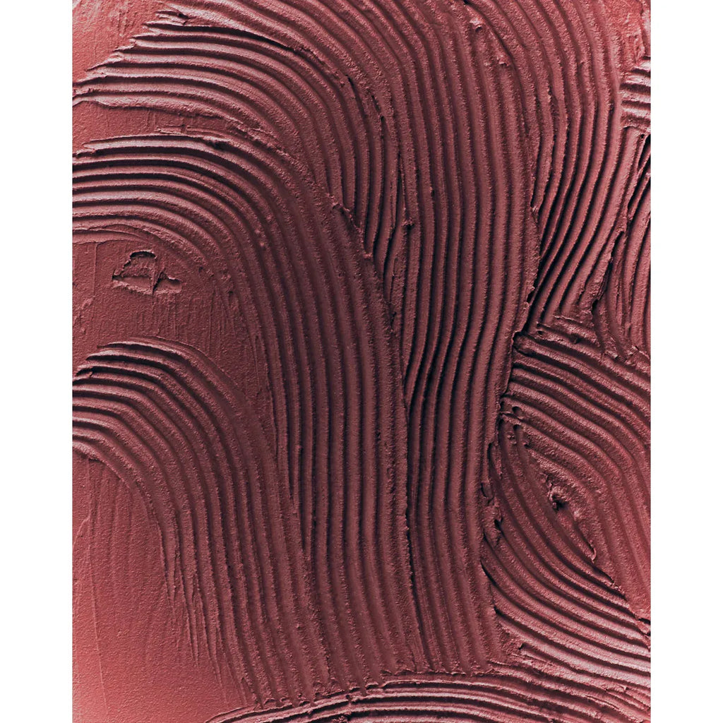 Abstract close-up of textured red surface with wavy patterns.
