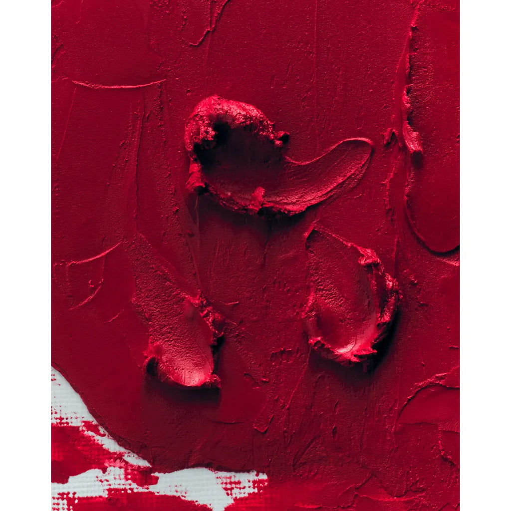 Close-up of textured red abstract painting.
