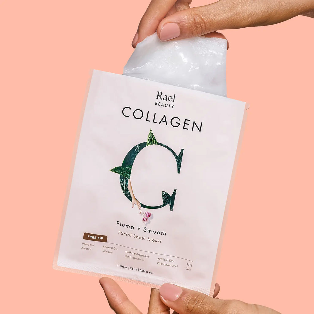Hands holding a rael beauty collagen facial sheet mask package against a pink backdrop.