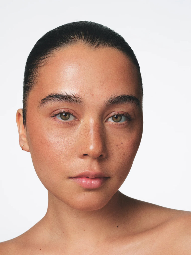 Model wearing shade Lumen Fara Homidi Essential Bronzer Compact