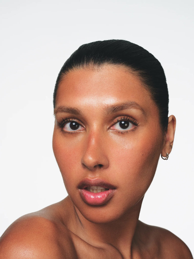 Model wearing shade Roma Fara Homidi Essential Bronzer Compact