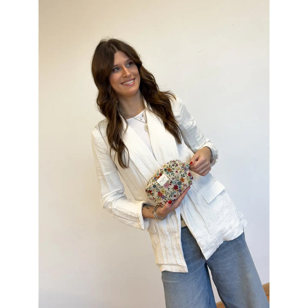 Model showing De La Mur Medium Makeup Bag Blum