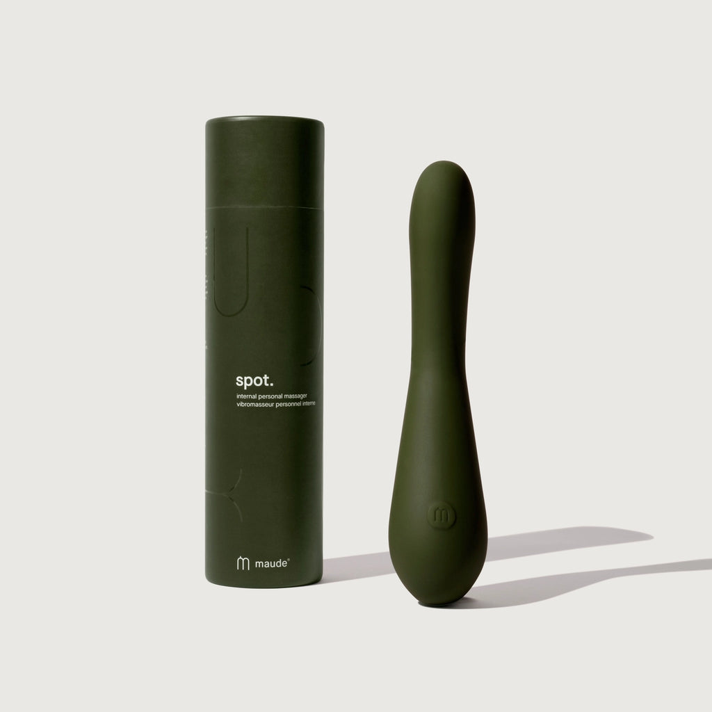 A personal massager and its packaging displayed on a neutral background.