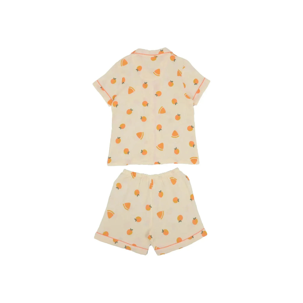 Children's Anna Kaci Fruit Pattern Lounge Coordinates consisting of a short-sleeve t-shirt and shorts, both featuring an orange fruit print on a light cream background, displayed on a white background.
