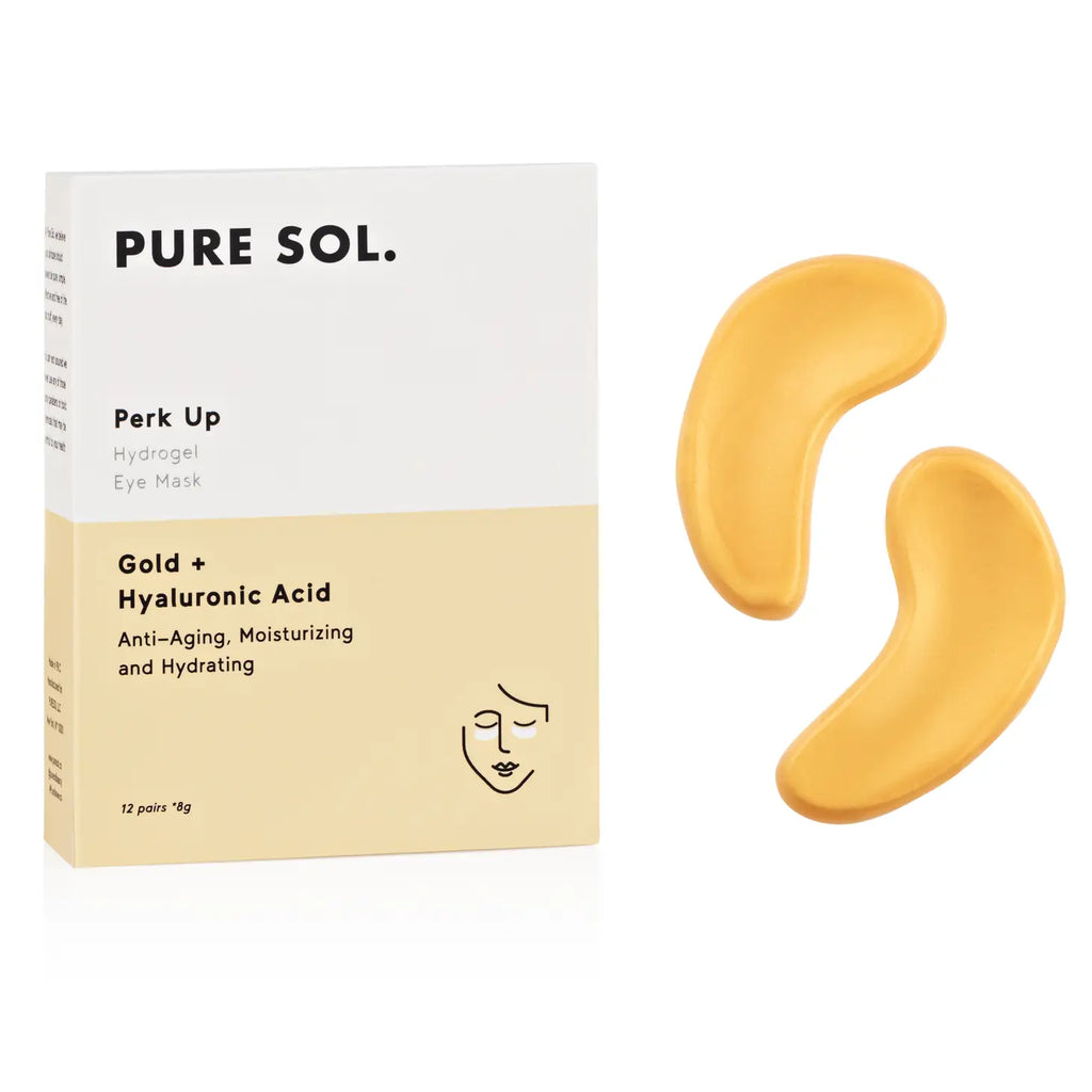 A box of pure sol. eye masks alongside a pair of gold-colored hydrogel under-eye patches.