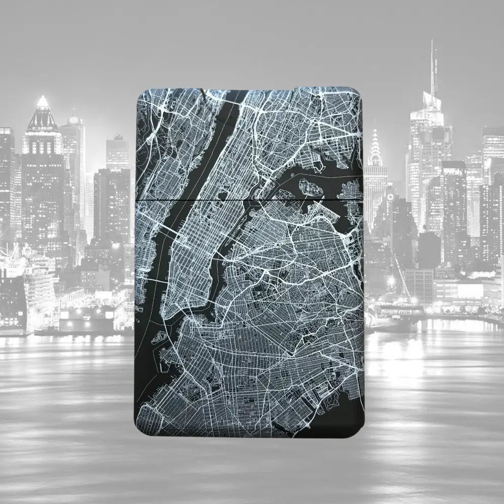 Stylized city map etched onto a notebook cover with an urban skyline backdrop.