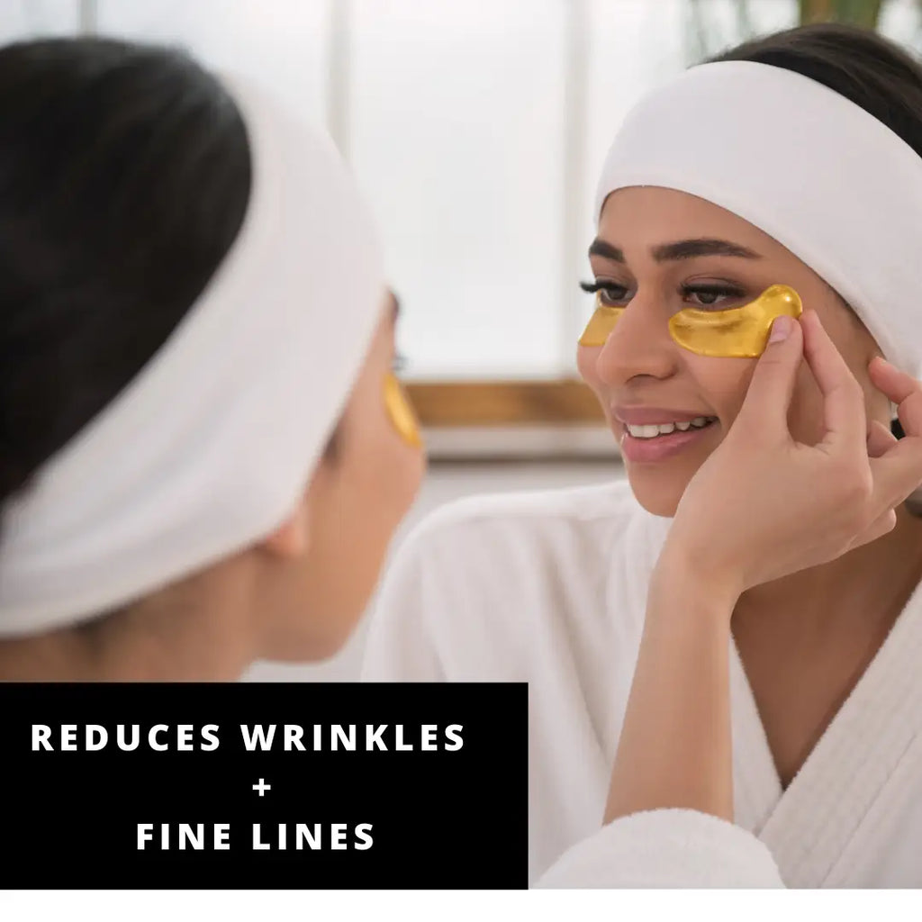 Woman applying under-eye patches for skincare.