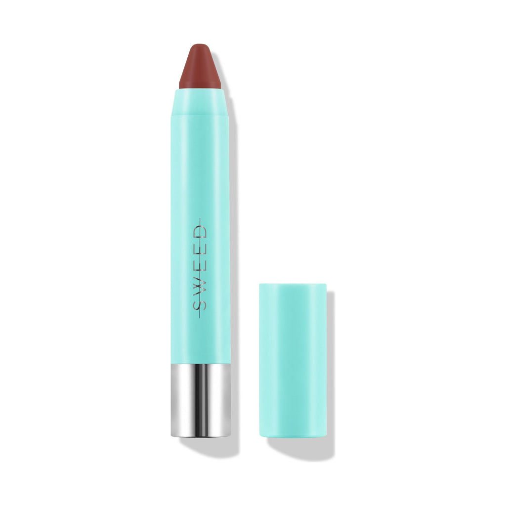 A brown lip crayon with a teal cap and silver base, isolated on a white background.