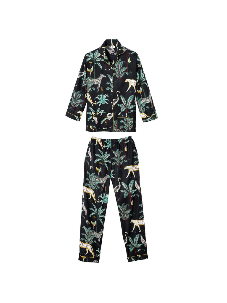 Camille wore the Germaine des Prés Camille Black Jungle Print Pajamas, showcasing a stylish botanical and animal print with long sleeves and pants made from 100% cotton for a timeless and sophisticated look.