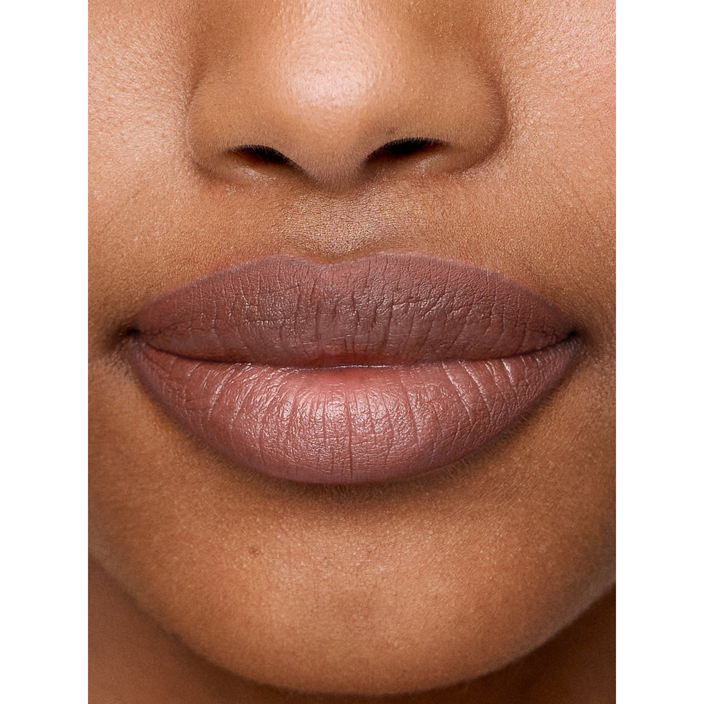 Close-up of a woman's lips with matte lipstick.