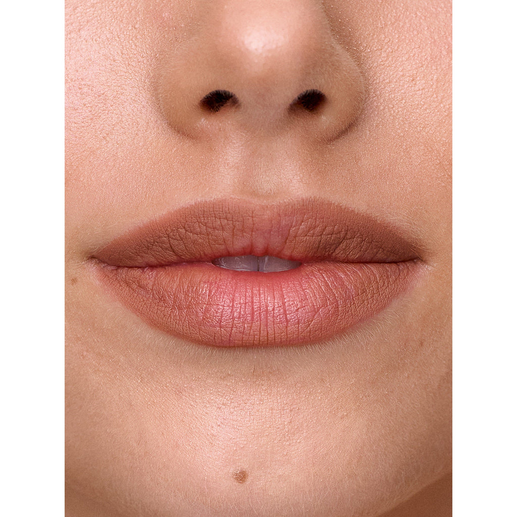 Close-up of a person's lips and the lower part of their nose.