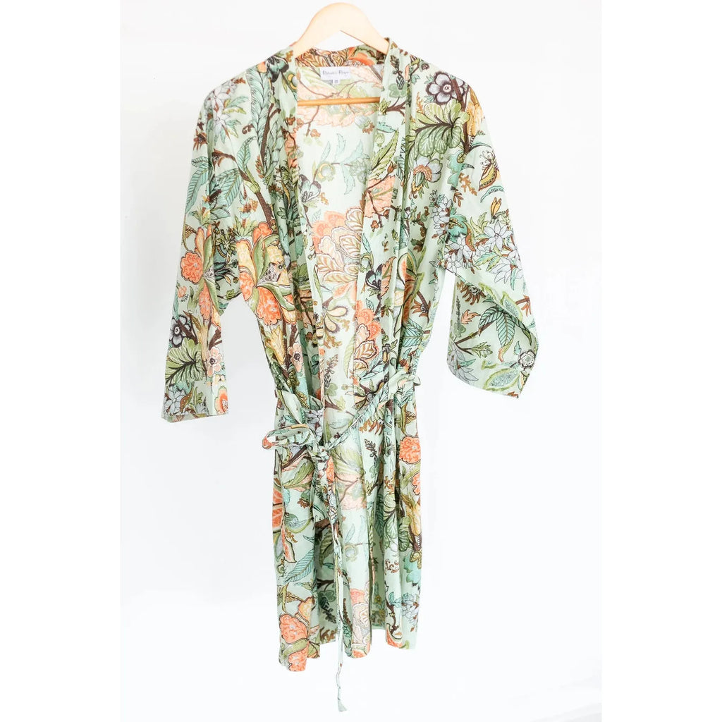 Floral print robe hanging on a white background.