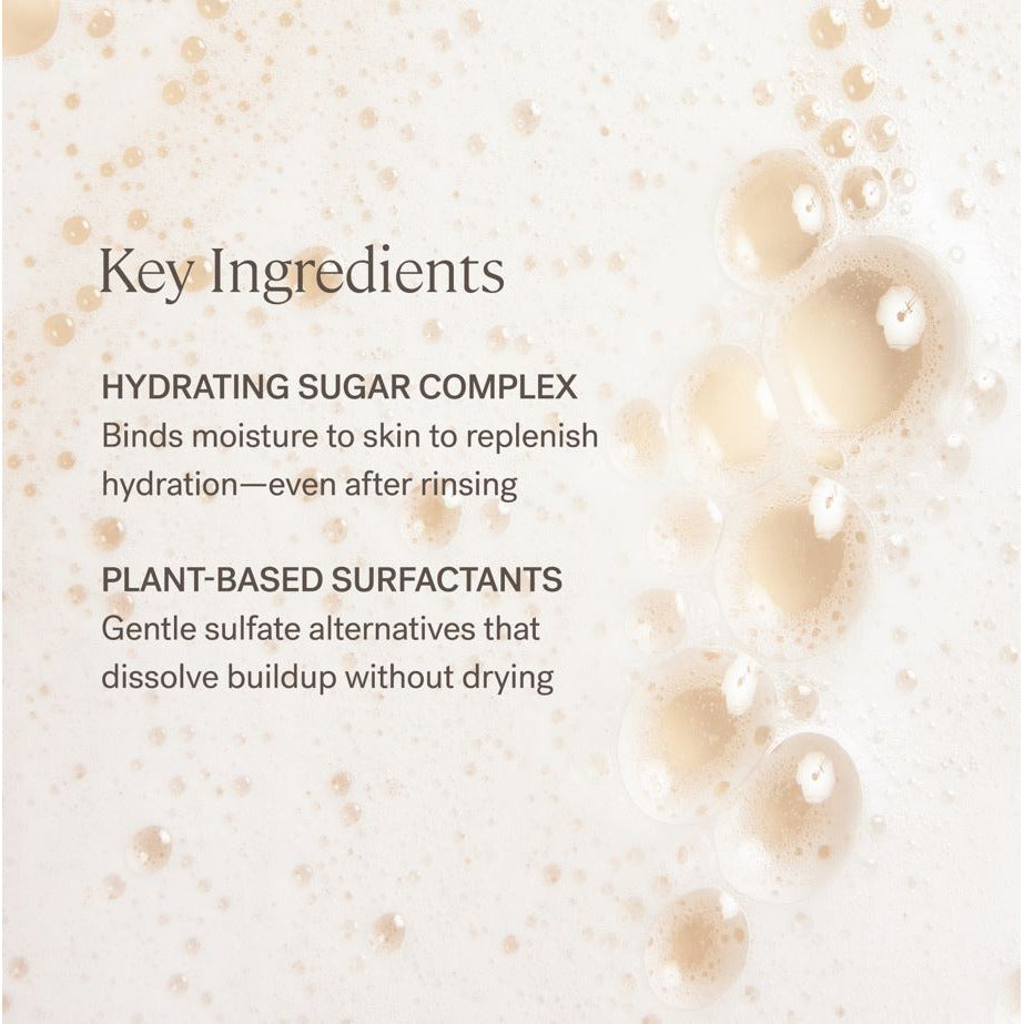Key ingredients of a skincare product highlighted with bubbles on a beige background.