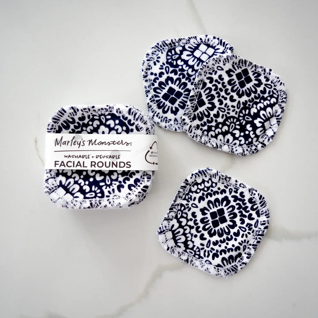 Marley's Monsters 20 Facial Rounds - Midnight Mosaic: a set of reusable, black and white patterned facial rounds made from 100% cotton flannel. The package includes twenty labeled as "Marley's Monsters Washable Reusable Facial Rounds," with three laid out and one packaged.