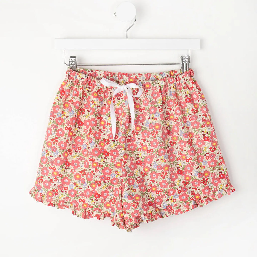 Loungewear Violet & Brooks Charlotte Ruffle Pj Shorts with ruffled hem and drawstring hanging on a white hanger against a plain background.