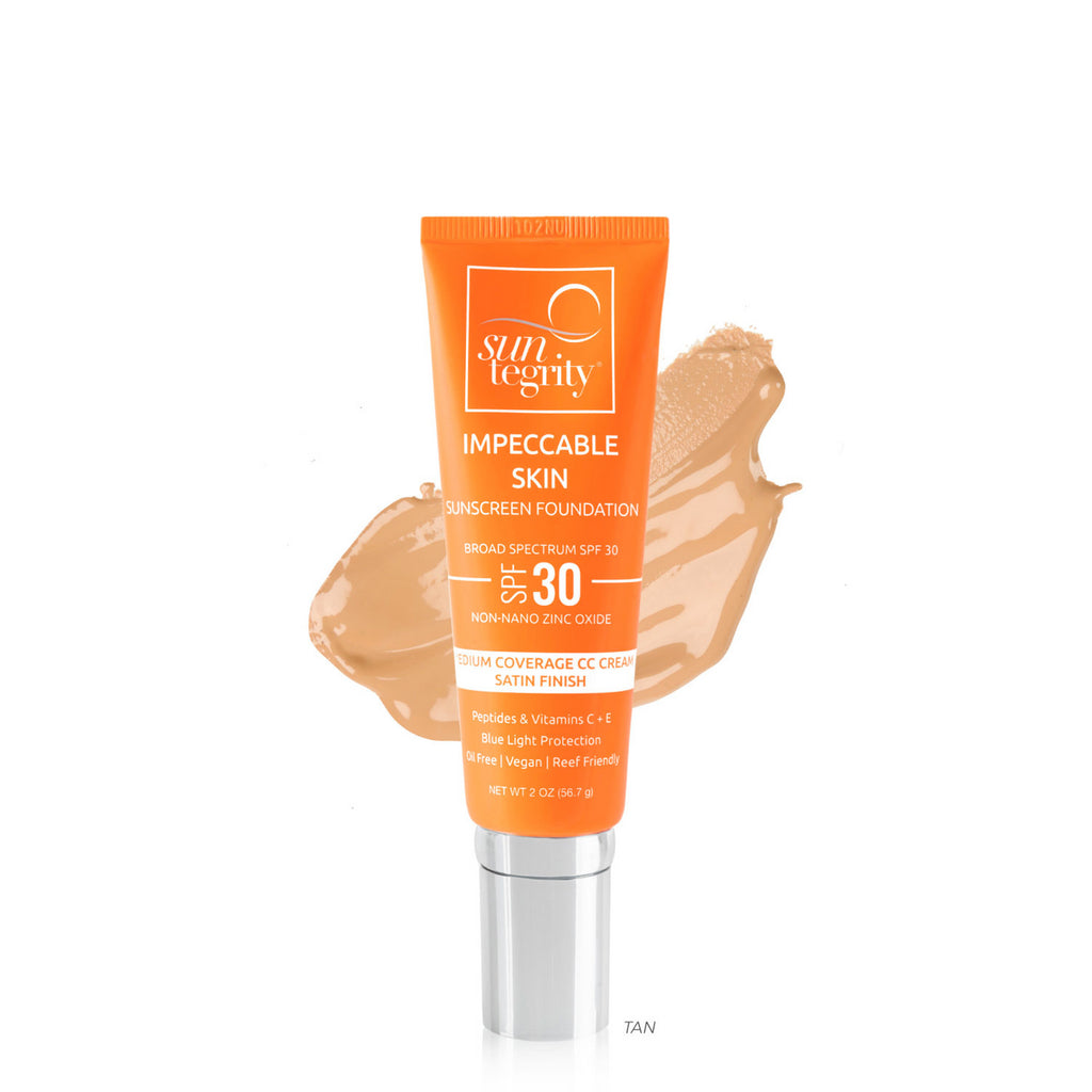 A tube of sun-integrity sunscreen with a swatch of tan foundation displayed against a white background.