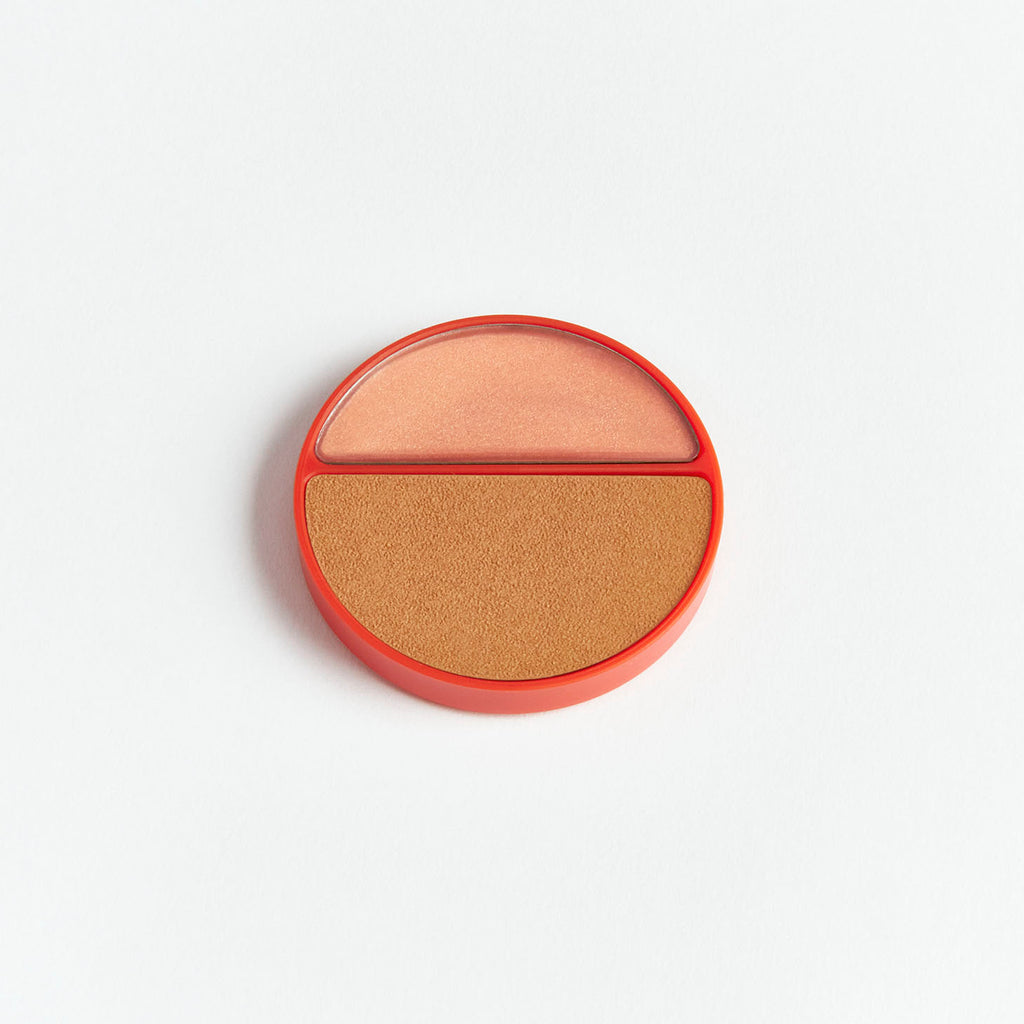 A split pan of bronzer and blush makeup compact.