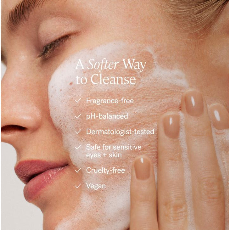 Close-up of a person's face with foaming cleanser applied, highlighting the cleanser's gentle and vegan attributes.