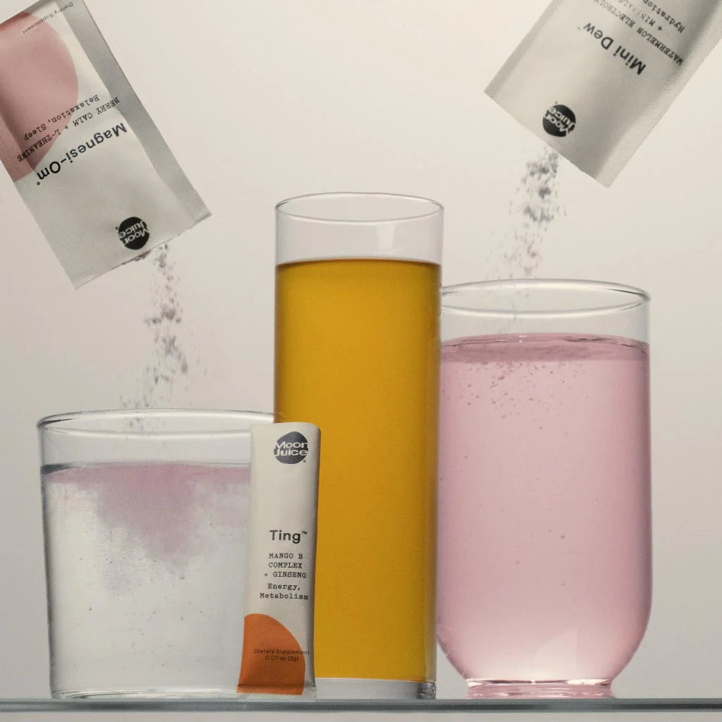 Three different beverages with powders being poured into them, alongside flavored effervescent tablets.