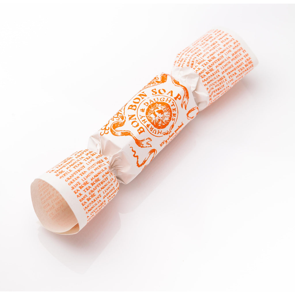 A christmas cracker with orange text and illustrations on a white background.