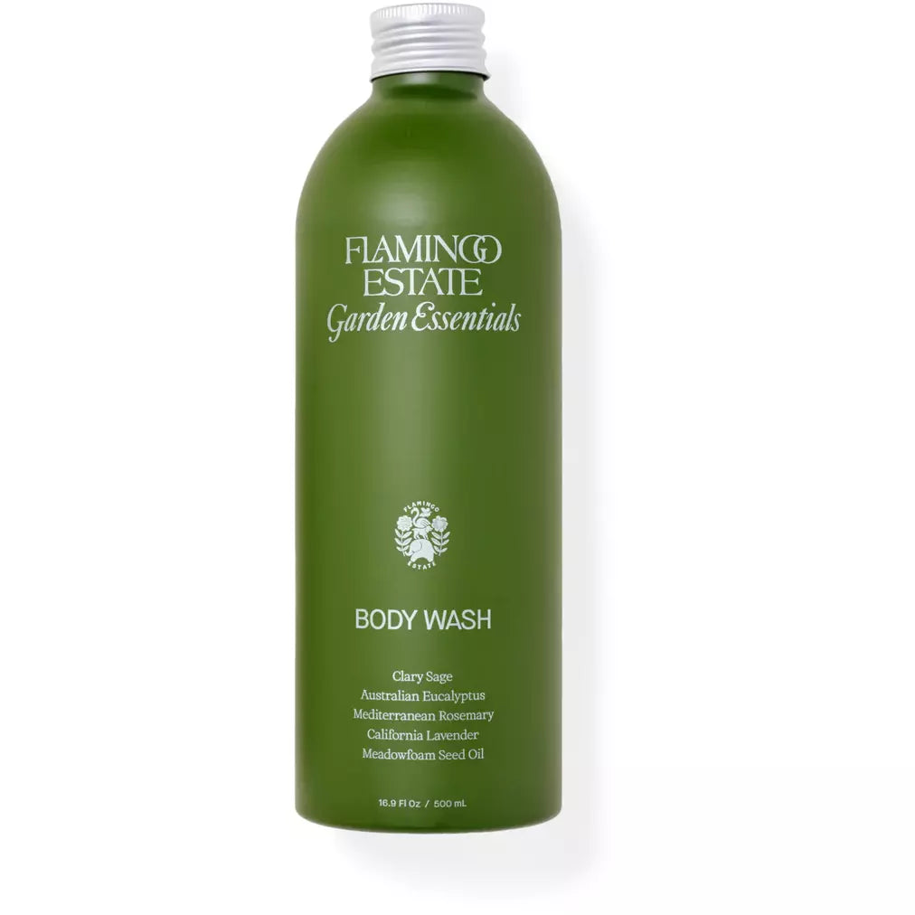 Green bottle of flamingo estate garden essentials body wash with clary sage and various botanical ingredients.