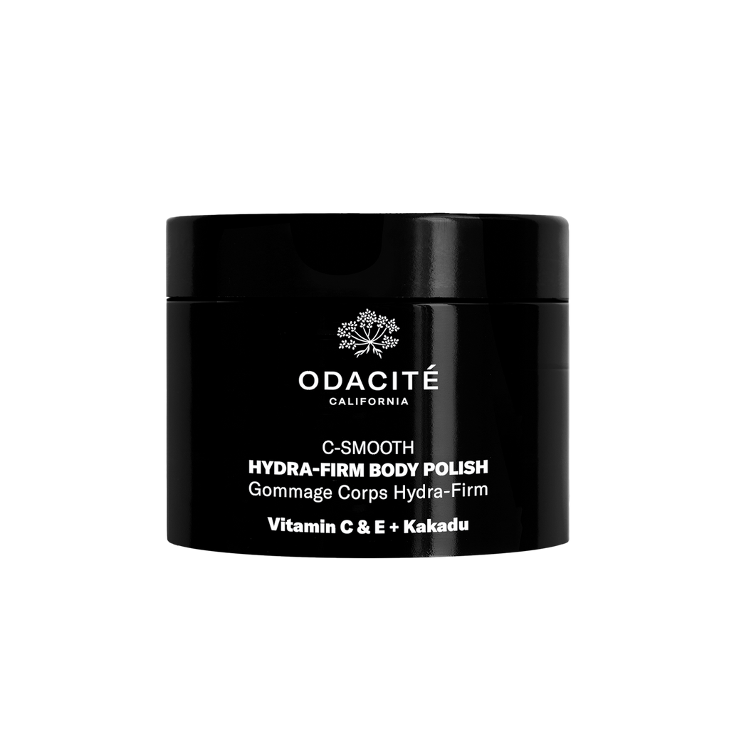 Black container of odacite hydra-firm body polish with vitamin c & e and kakadu plum.