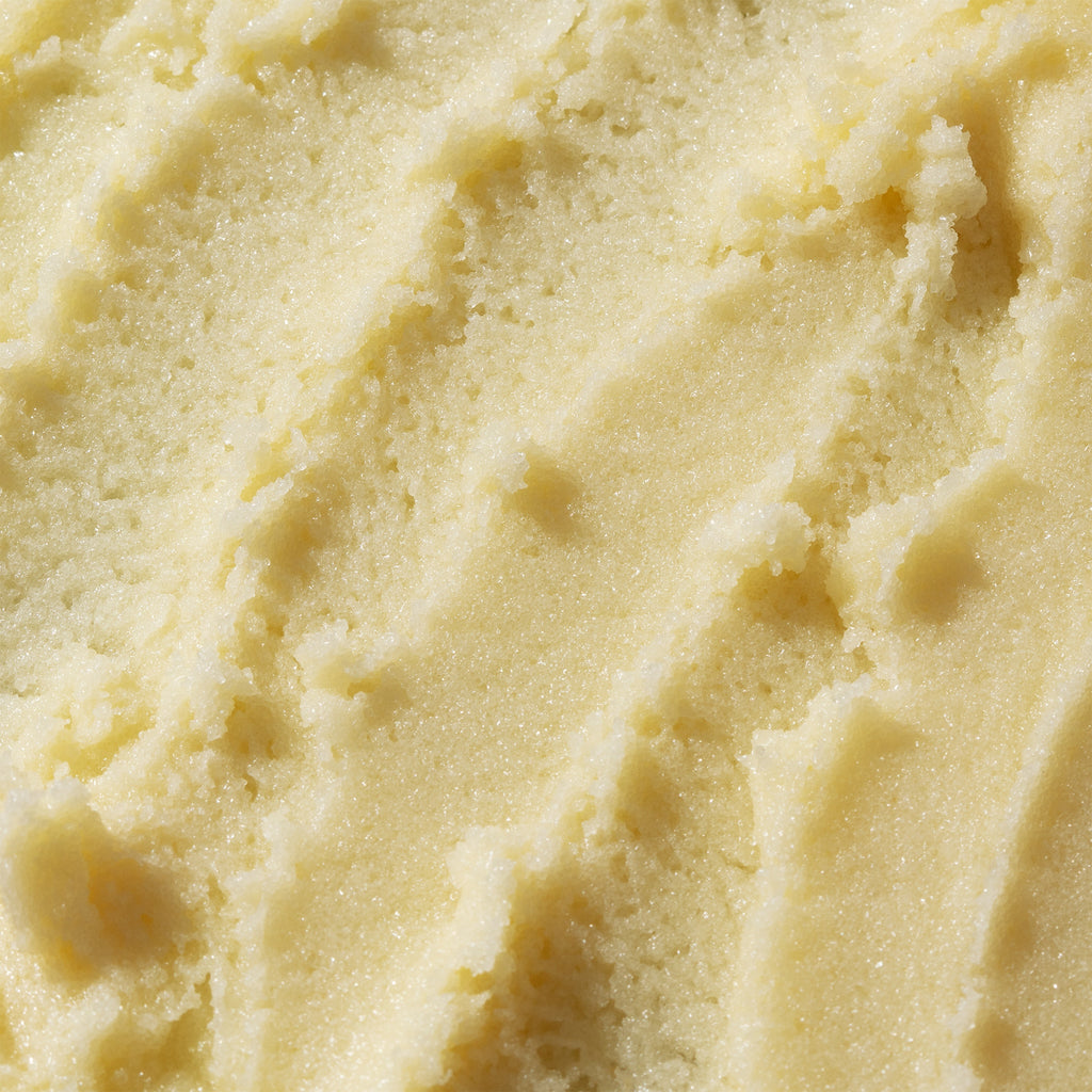 Close-up of textured vanilla ice cream surface.